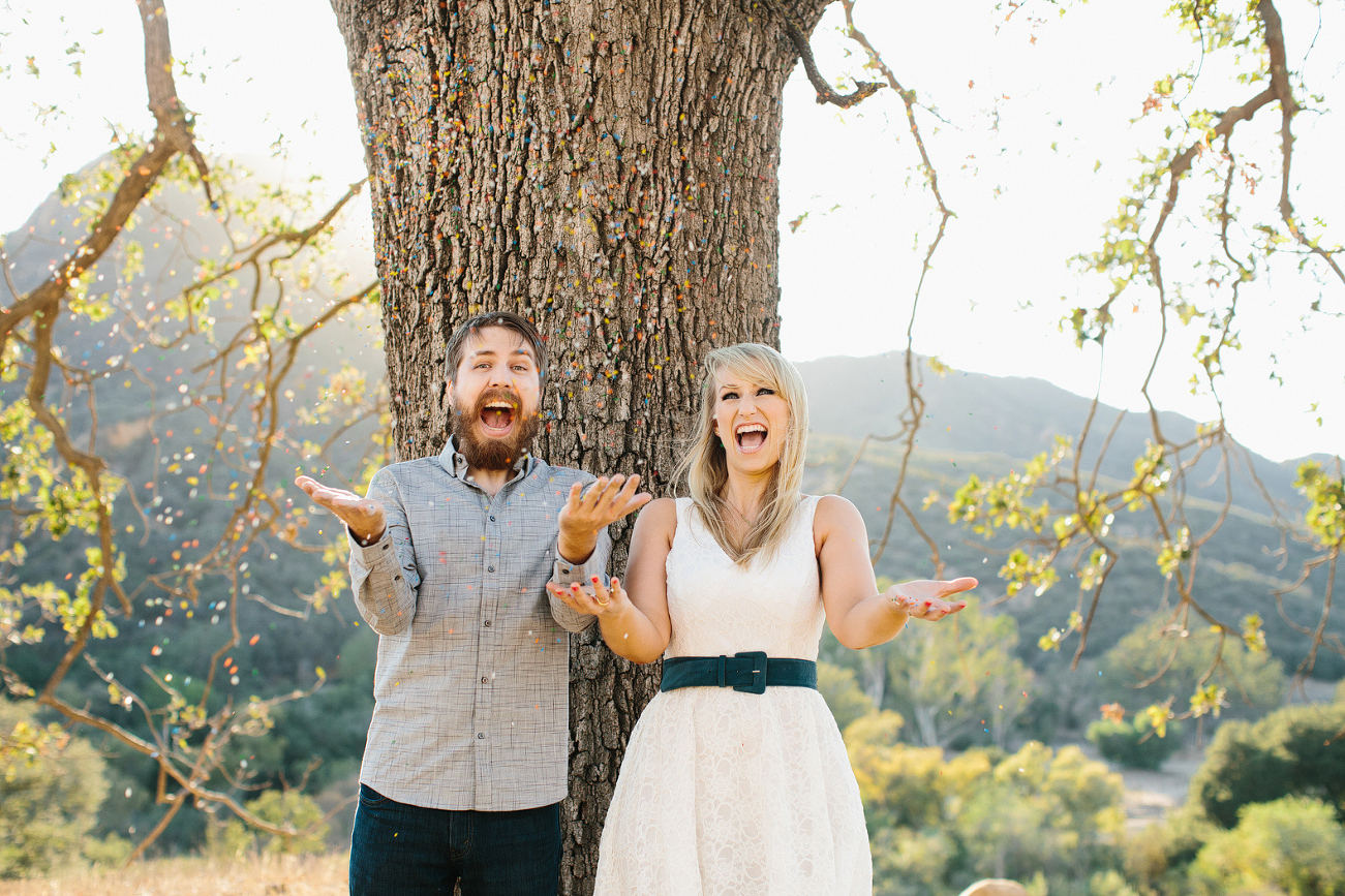 Lindsay and Josh throwing sprinkles in the air. 