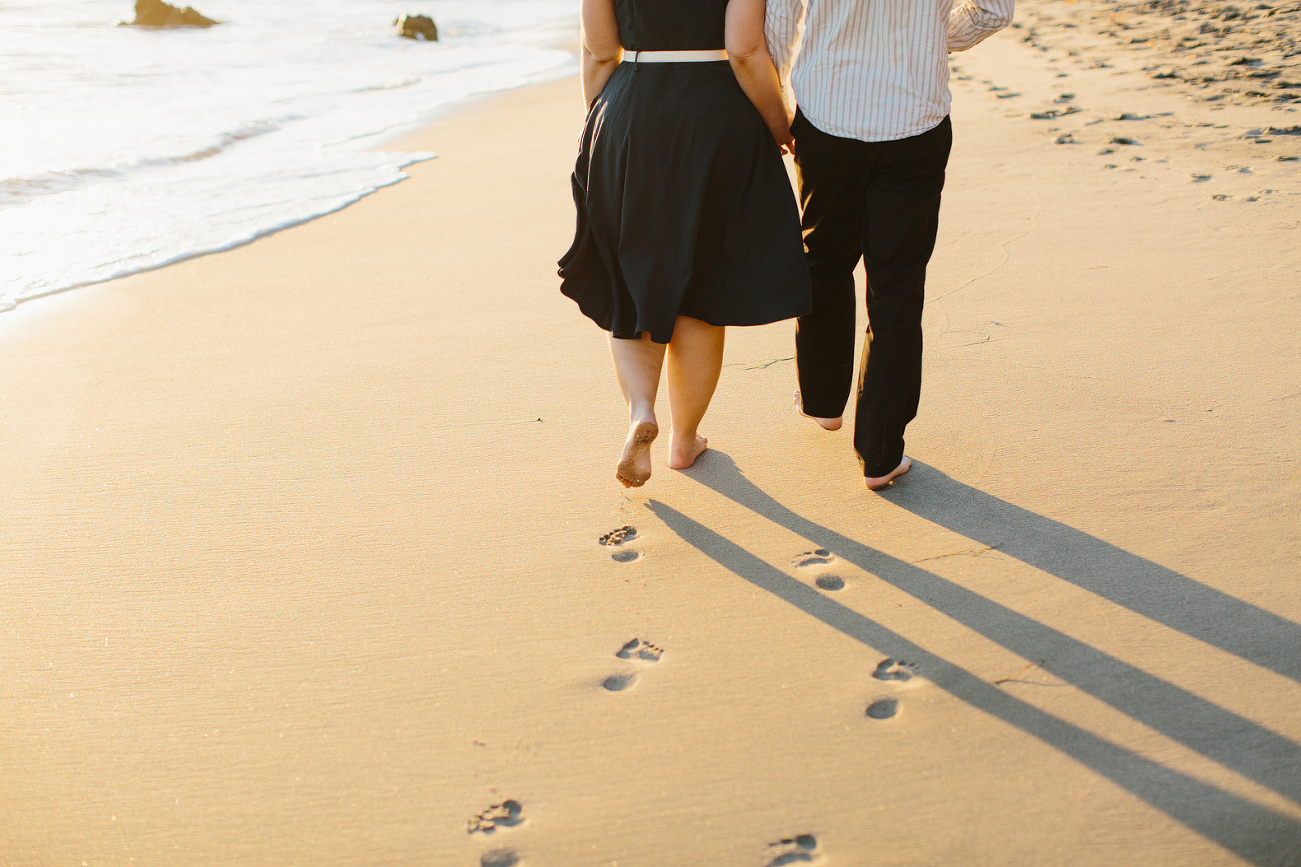 Lindsay and Josh walking on the beach. 