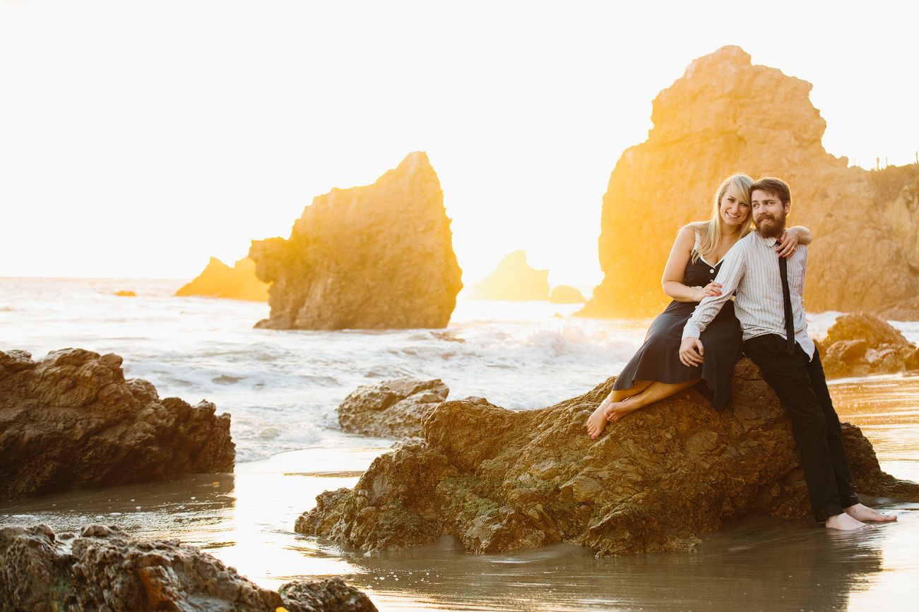 The couple on a beach rock. 