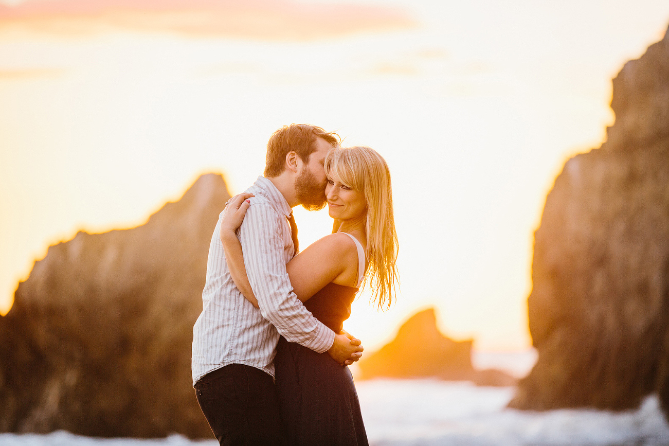 The couple on the beach at sunset. 