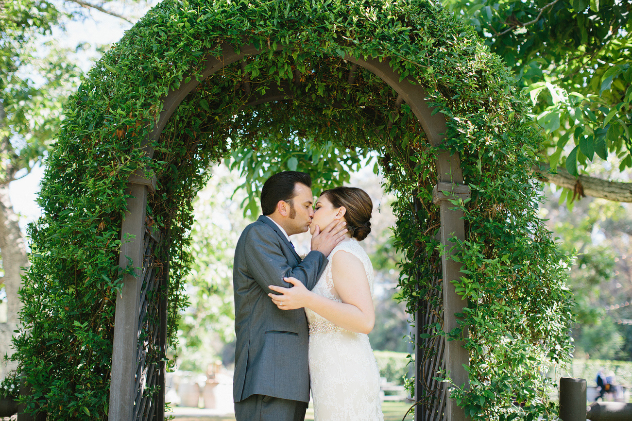 Whitney and JD under an arch. 