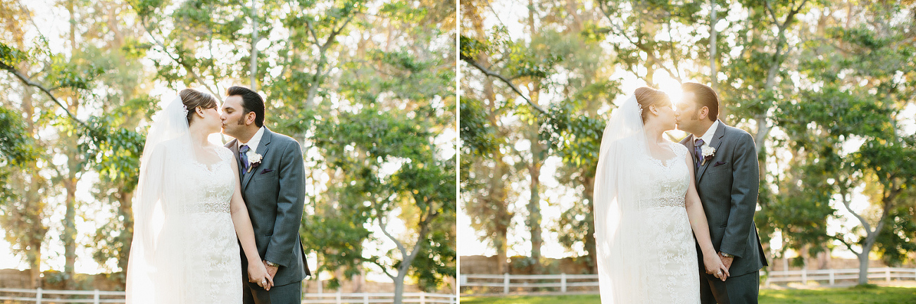 The bride and groom in front of trees. 