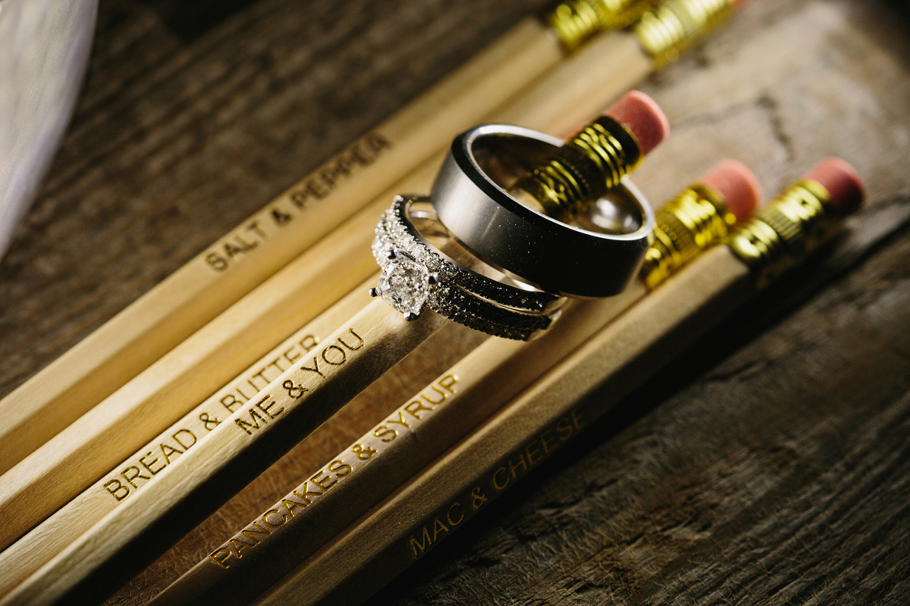 The wedding rings on a pencil. 