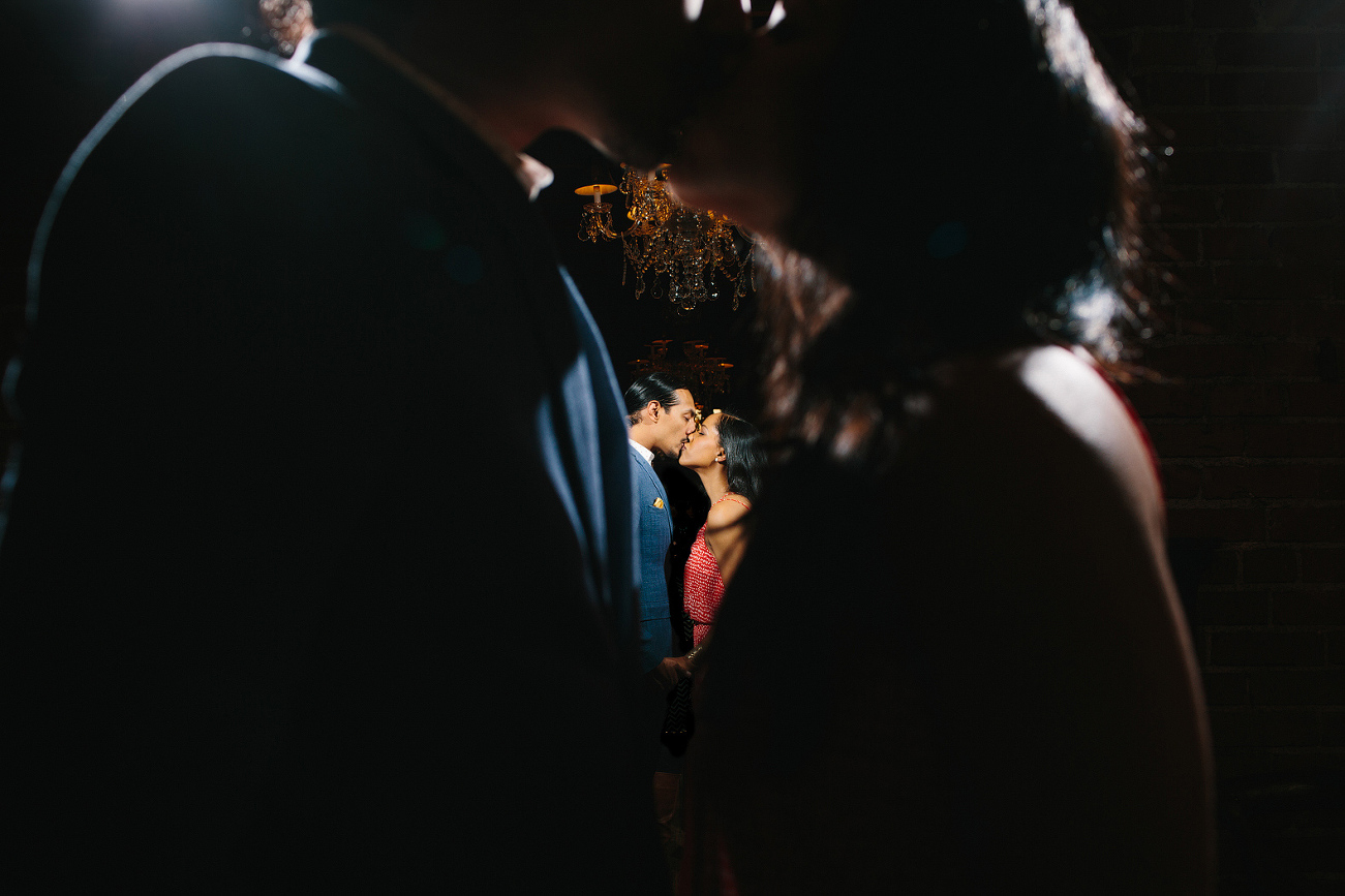 A photo of the couple in the mirror. 