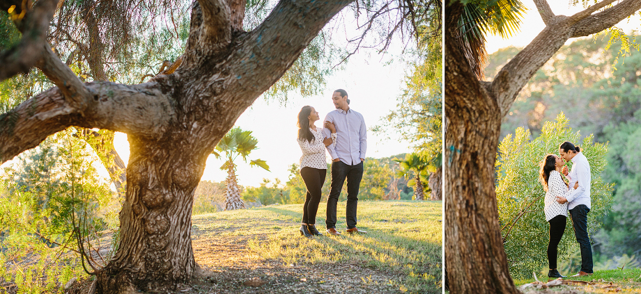 The couple near a tree. 