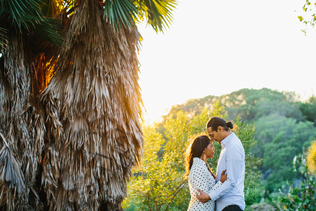 Alanna and David near trees. 