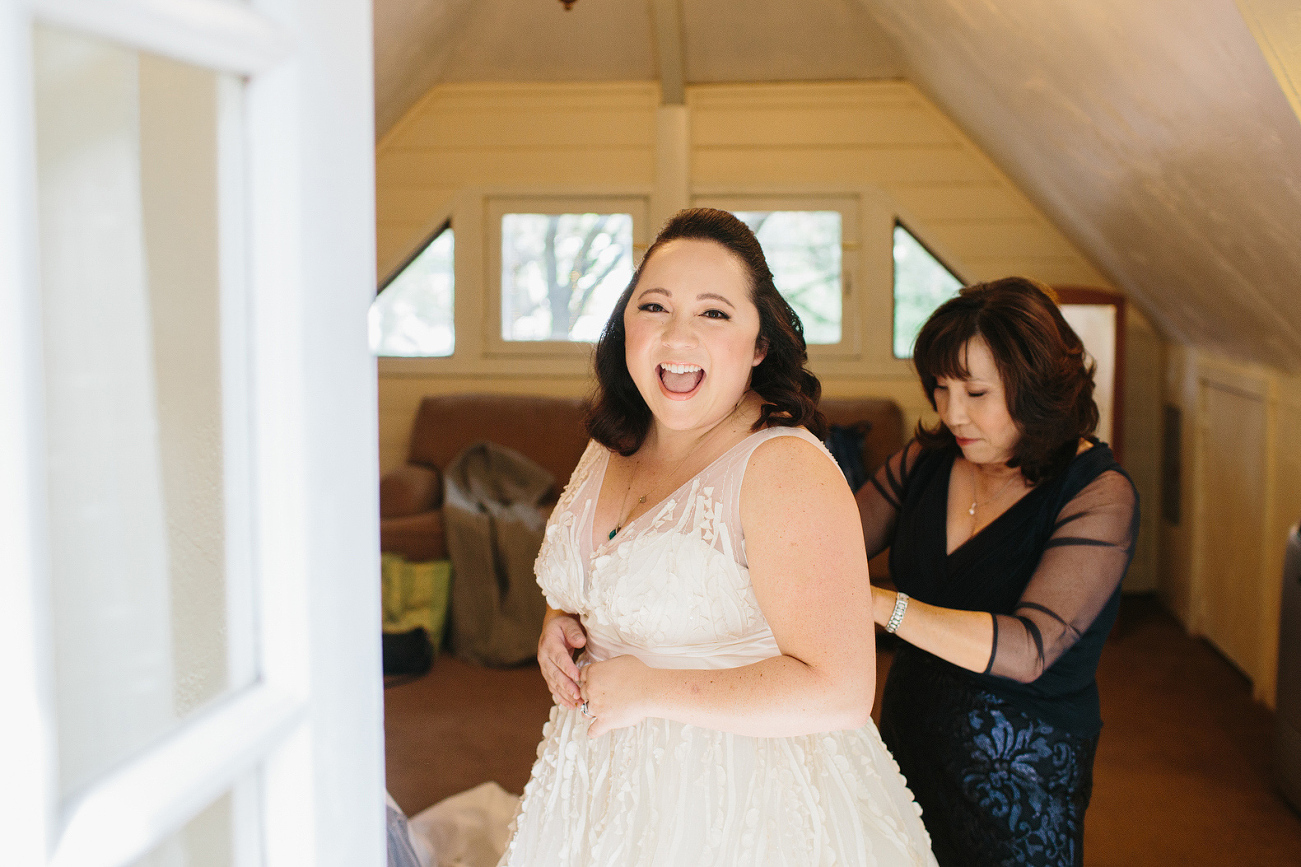 A sweet photo of Andrea getting in her dress. 