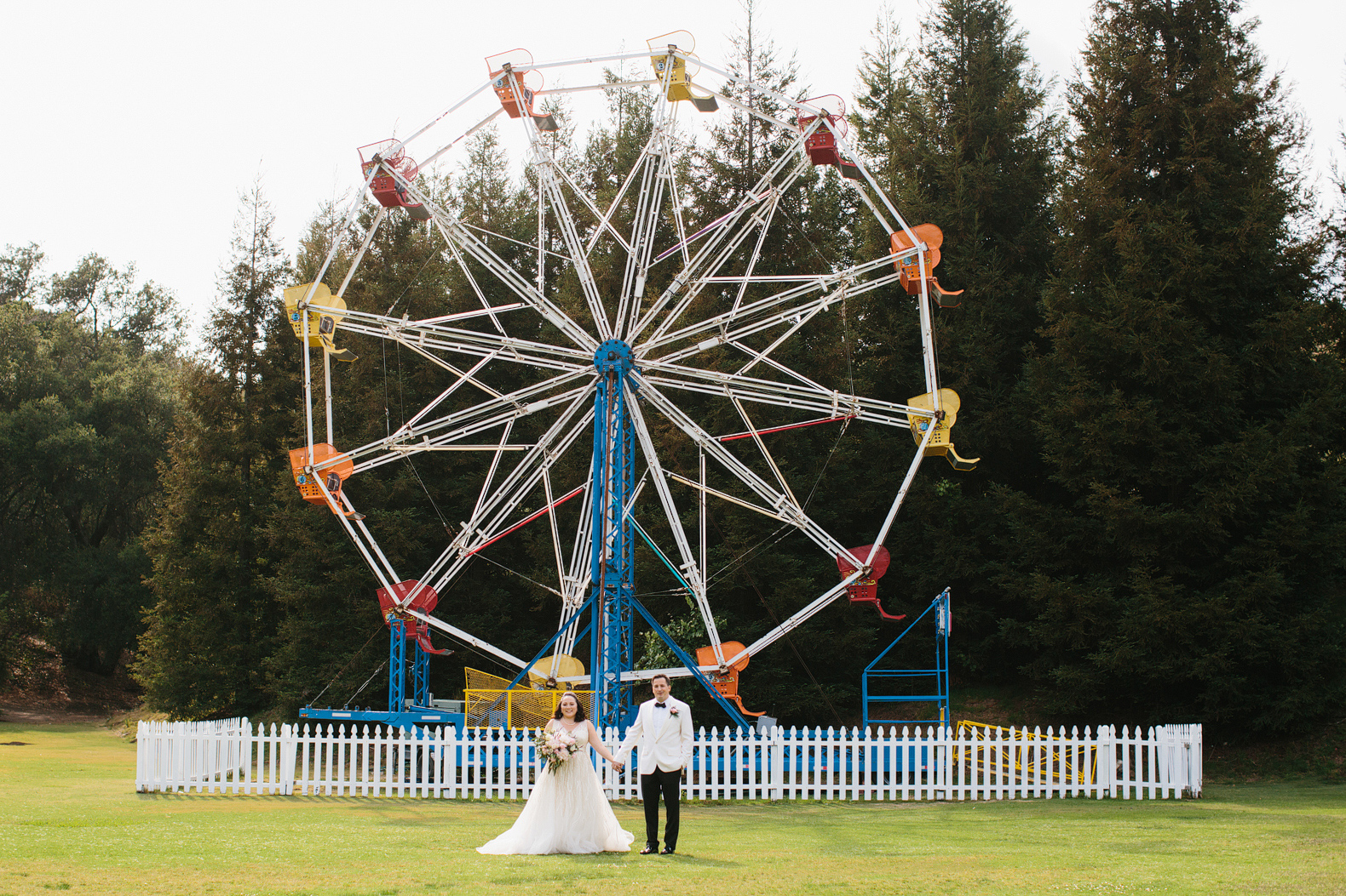 The couple in front of the Ferris Wheel. 