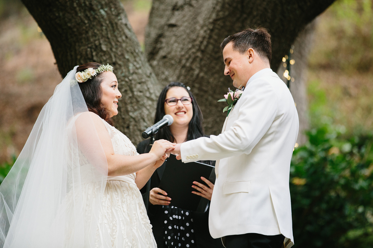 The bride putting on the groom