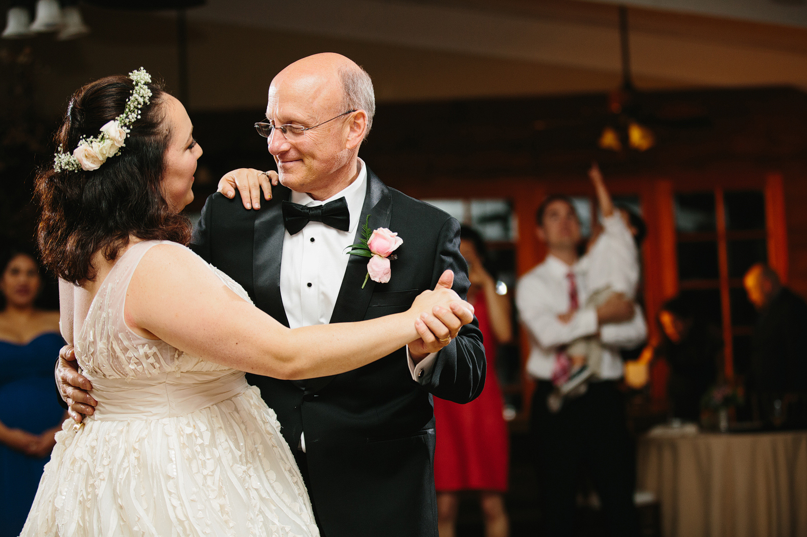 The bride and her dad dancing. 