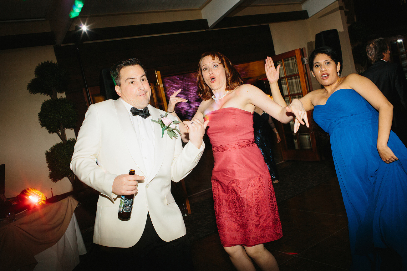 The groom dancing with friends. 