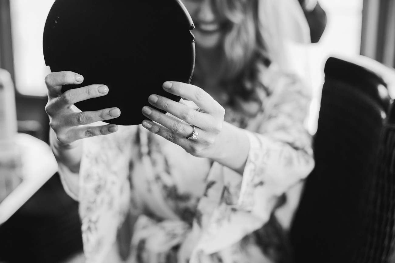 The bride looking in a mirror. 