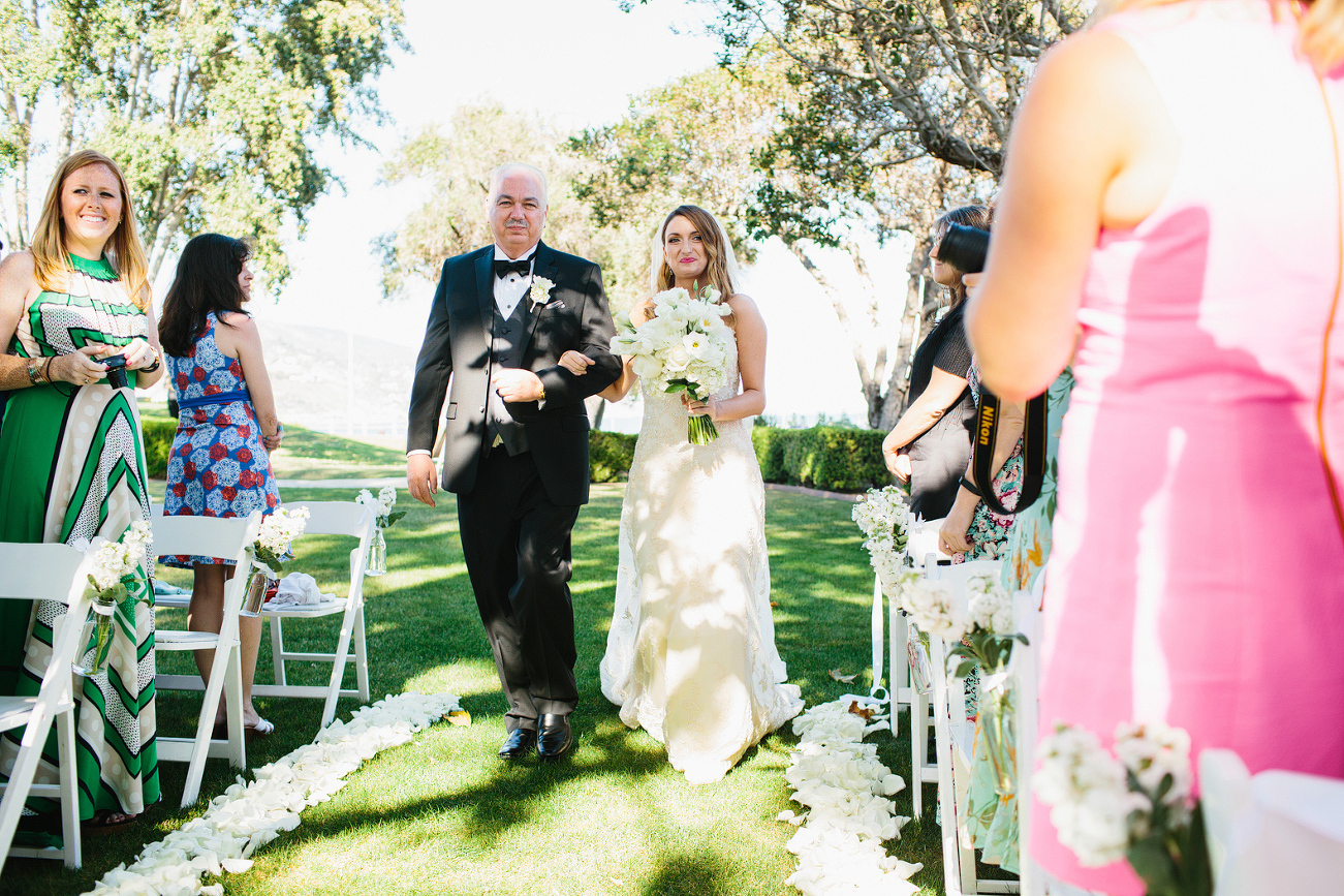 Ally and her dad walking down the aisle. 