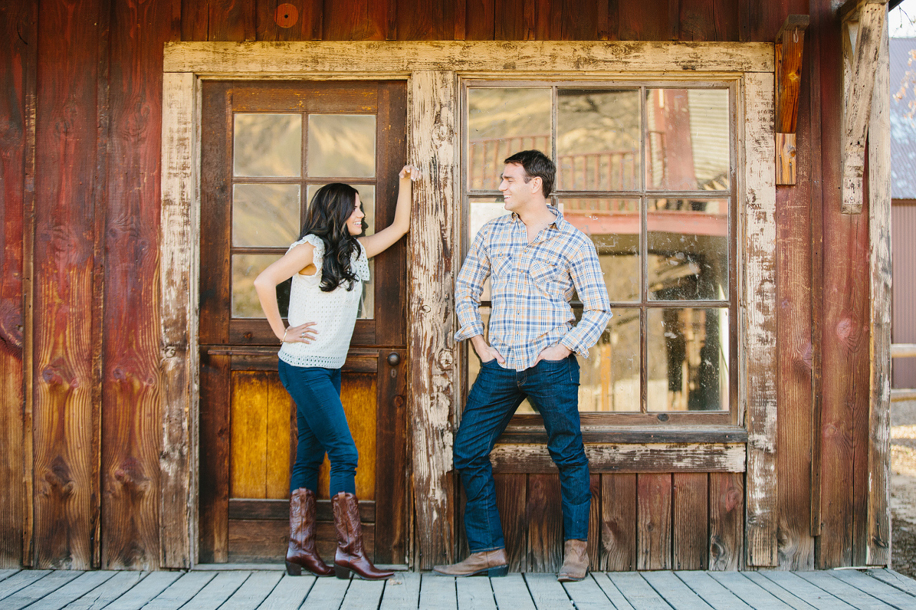 Miren and Peter standing on a porch. 