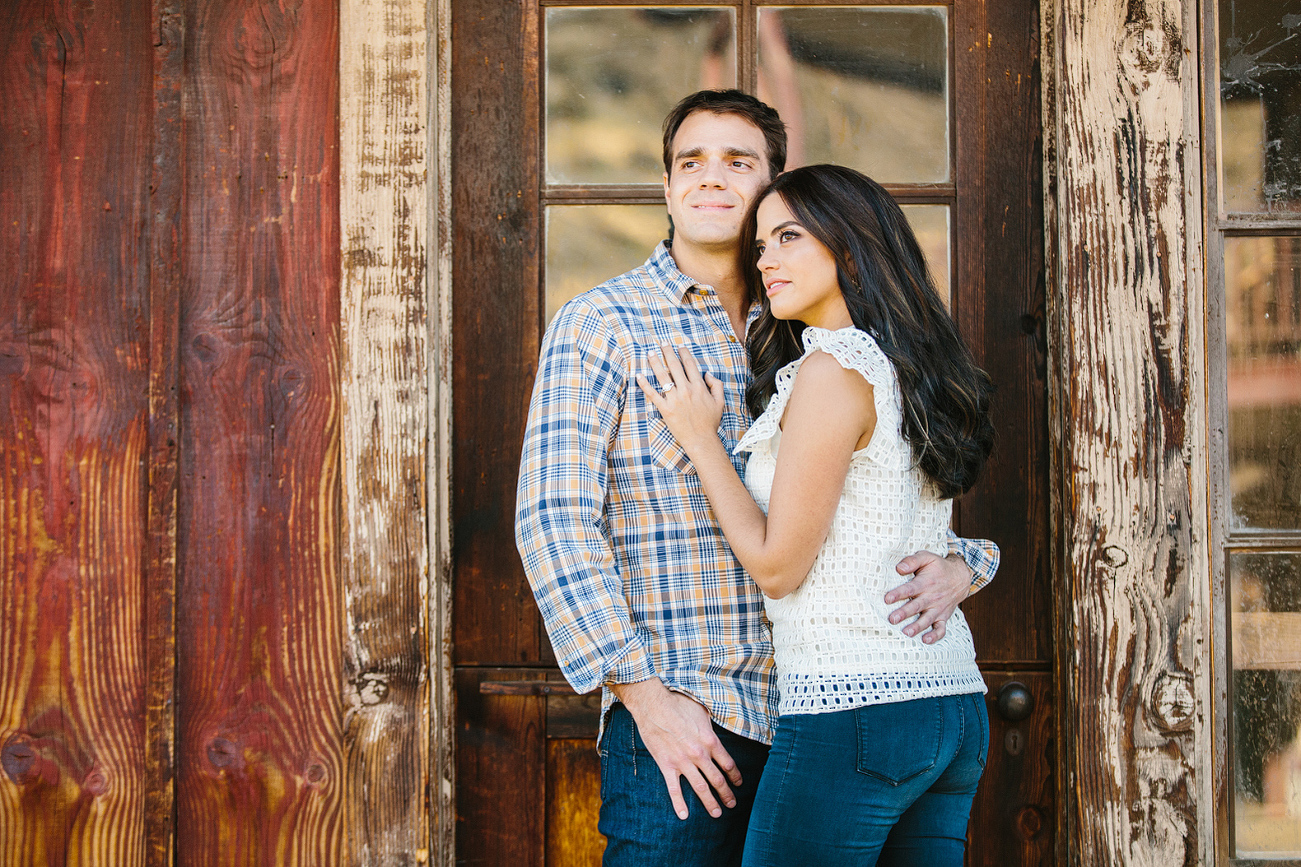 Miren and Peter leaning on a door. 