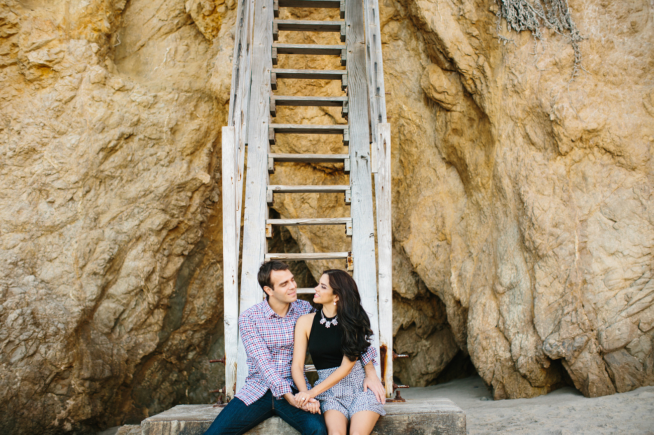 Miren and Peter sitting on the stairs. 