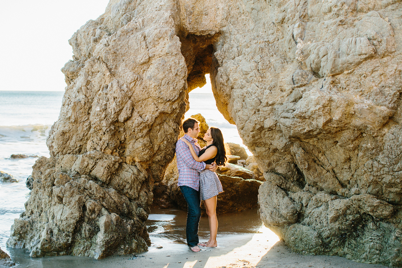 The couple standing in a rock. 