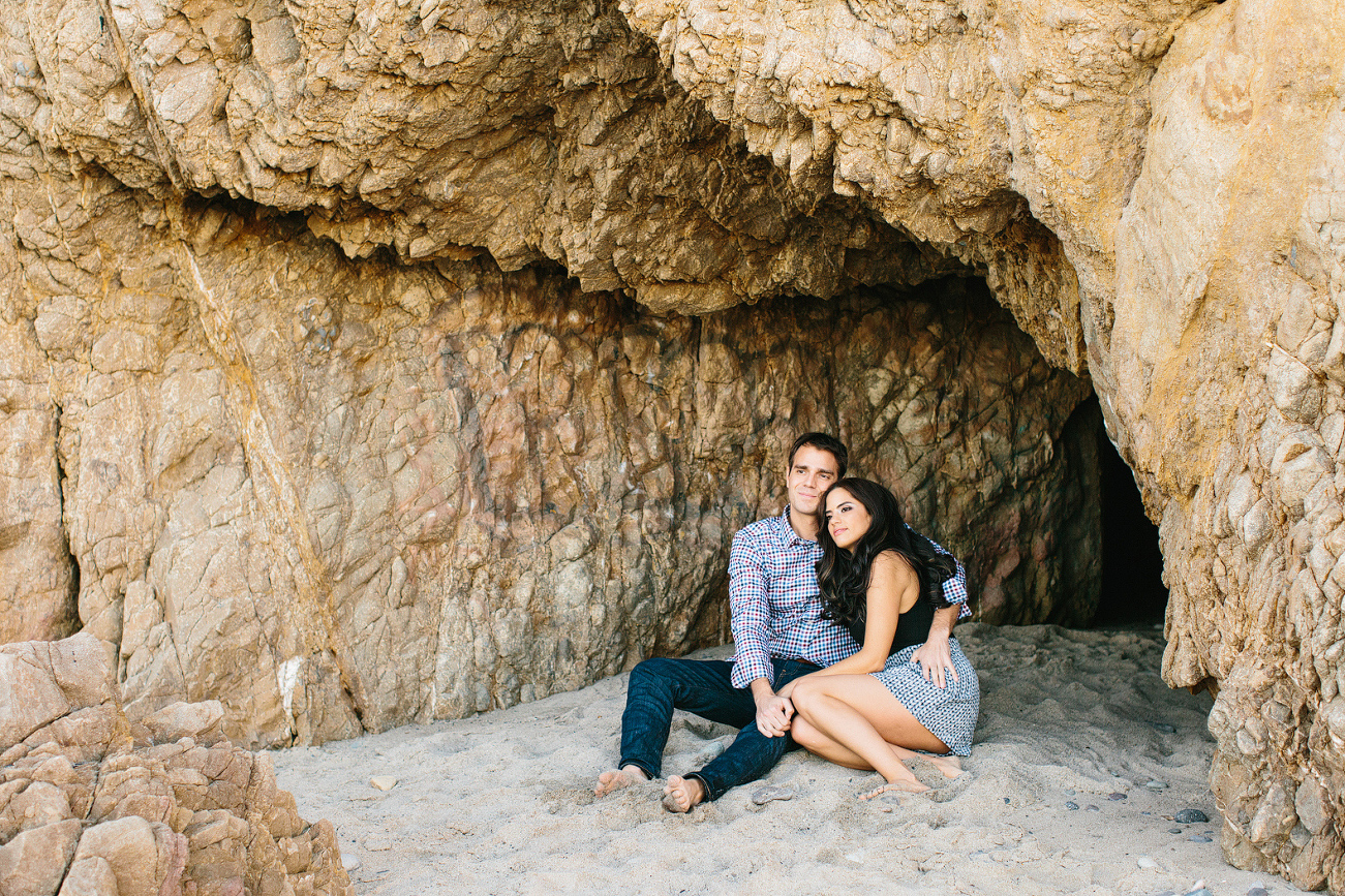 Miren and Peter sitting in the sand. 