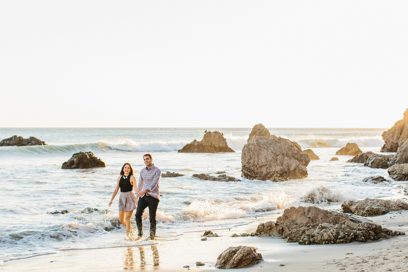 Miren and Peter walking on the beach. 