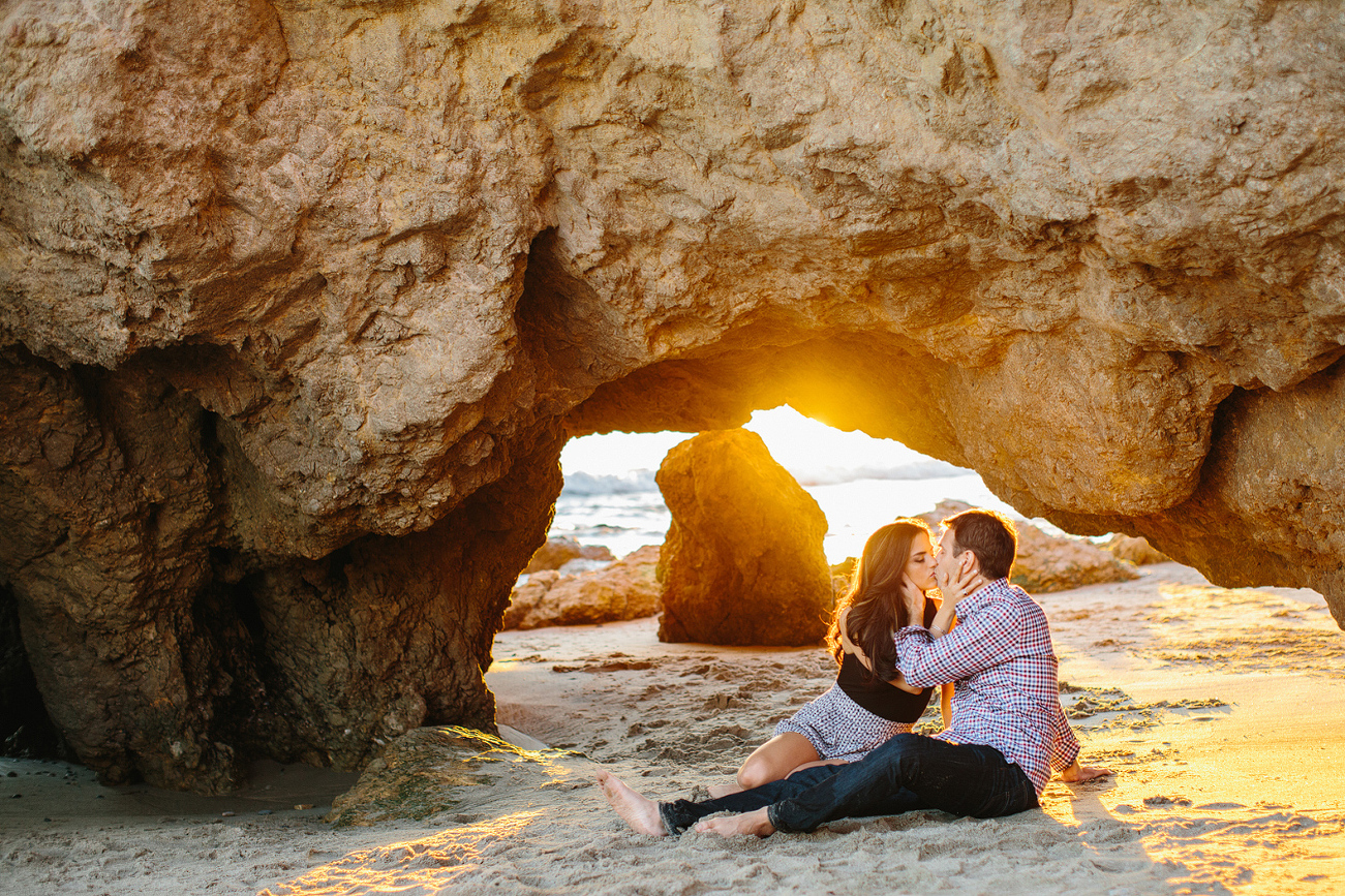 Miren and Peter kissing at sunset. 