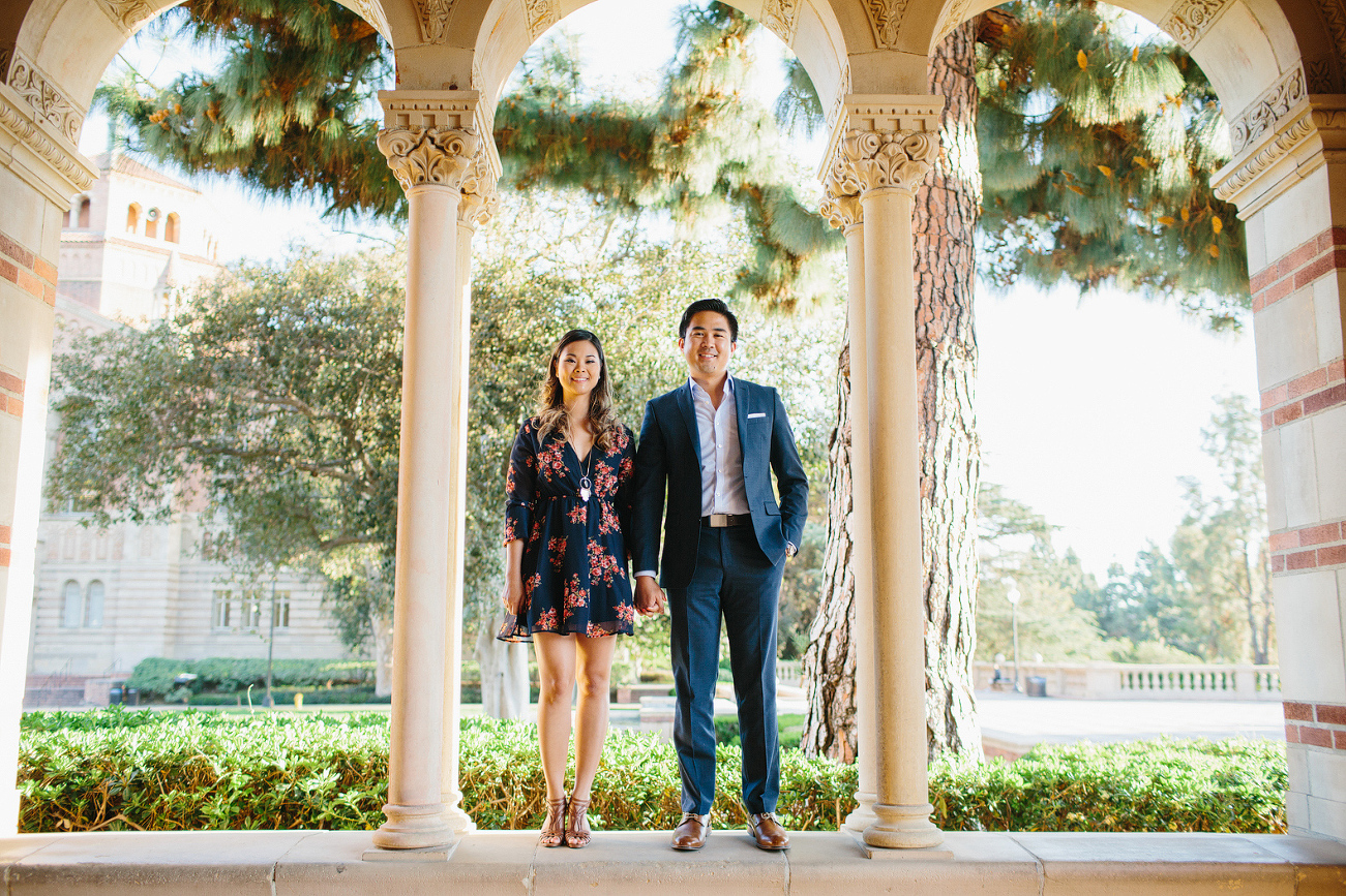 The couple standing on a wall. 