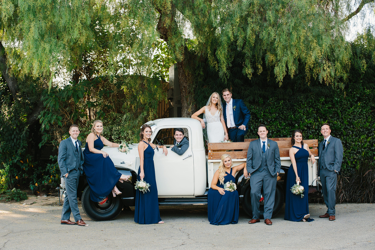 Weding party posed on vintage truck
