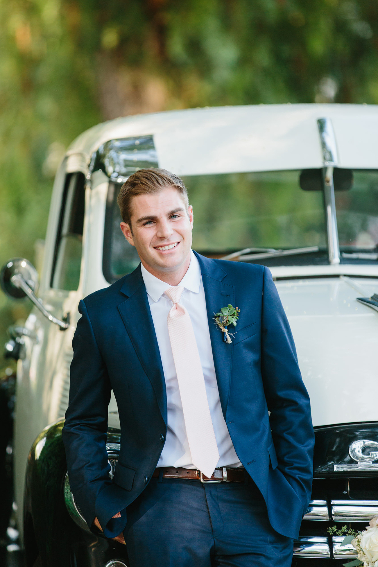 groom and vintage truck at wedding