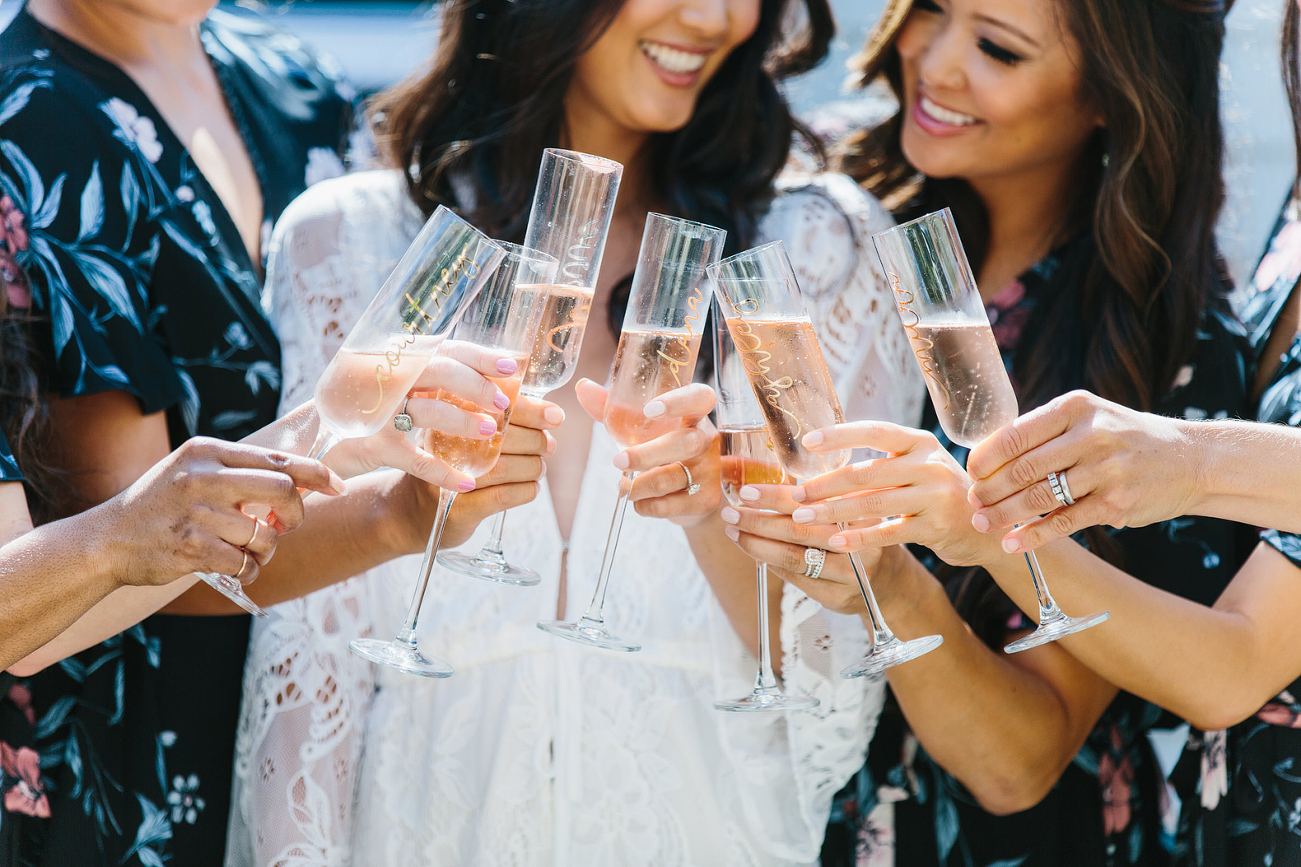 close up of champagne as bride toasts bridesmaids