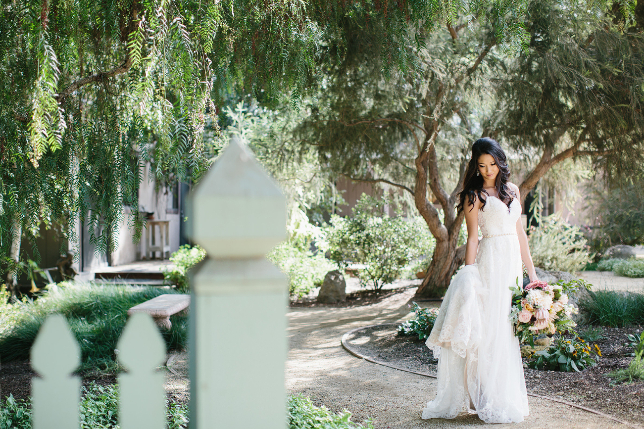 bride in the garden in gorgeous lace dress