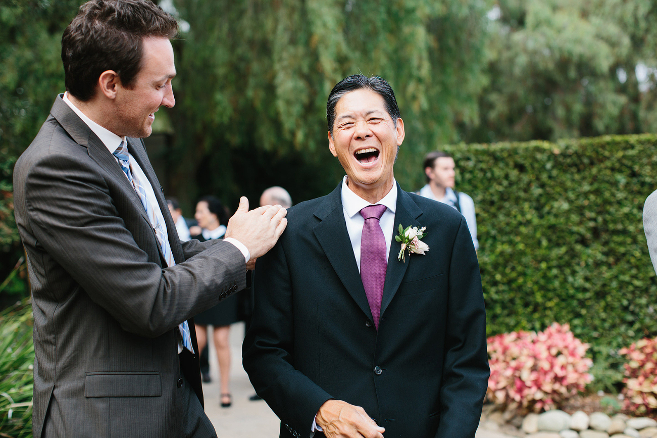 father of bride laughing before ceremony