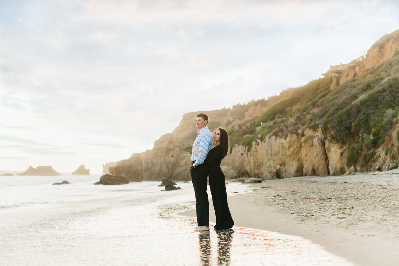 engagement session at the beach in the water