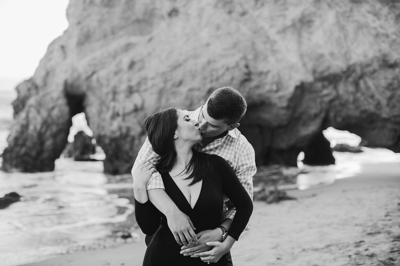 romantic engagement photo on the beach in black and white
