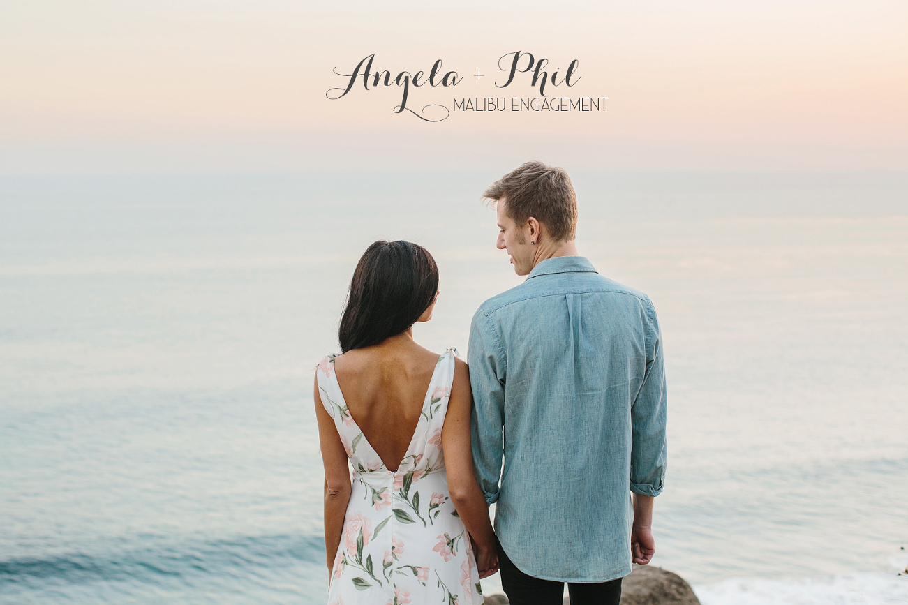An engaged couple overlooking the pacific ocean at sunset