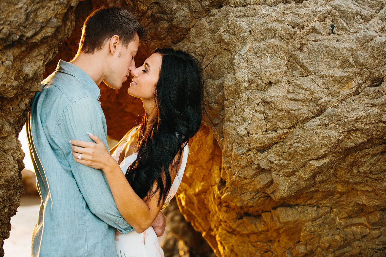 Almost kiss engagement photo session pose in warm beach light