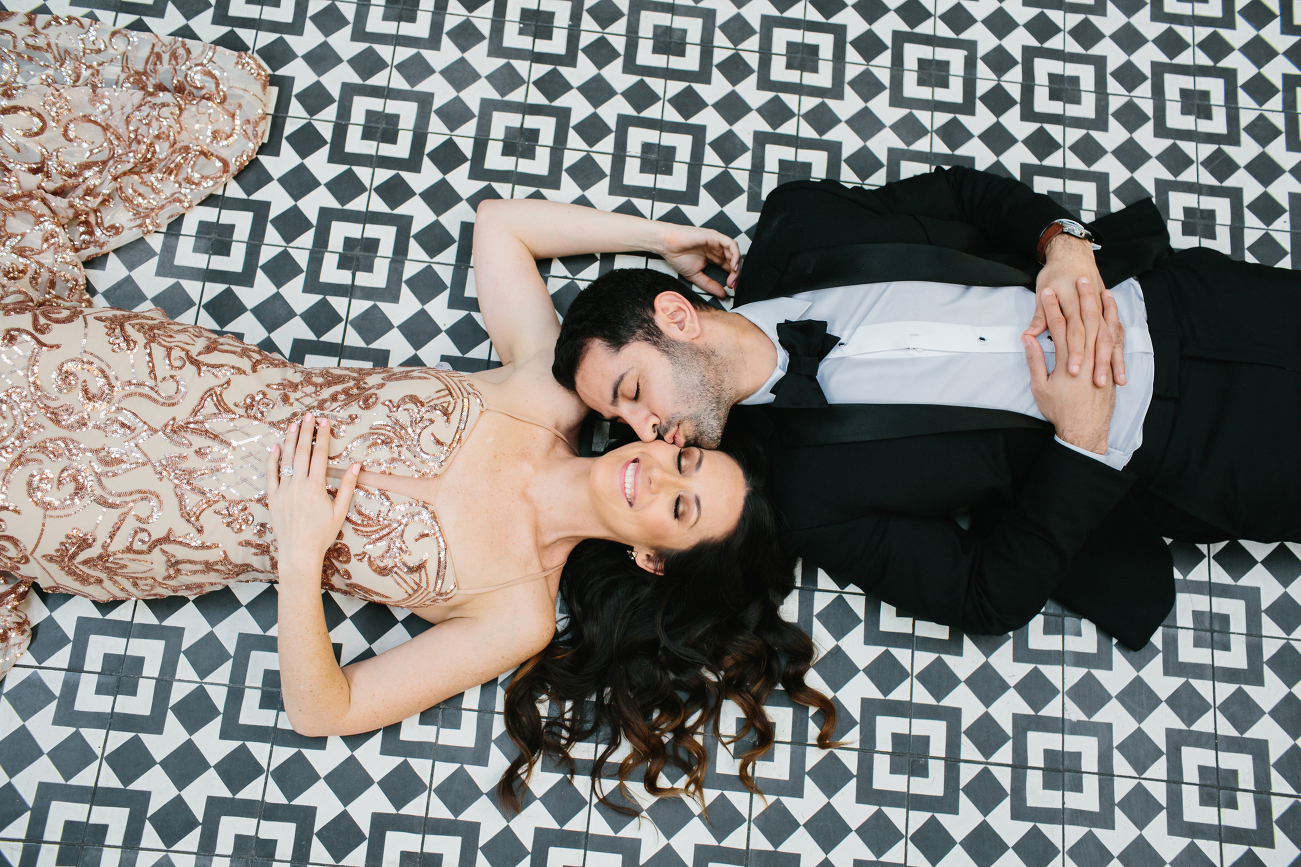 engagement photo with couple laying down